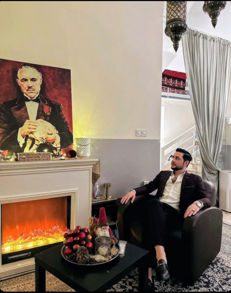 Maher Moustafa seated in a refined interior
