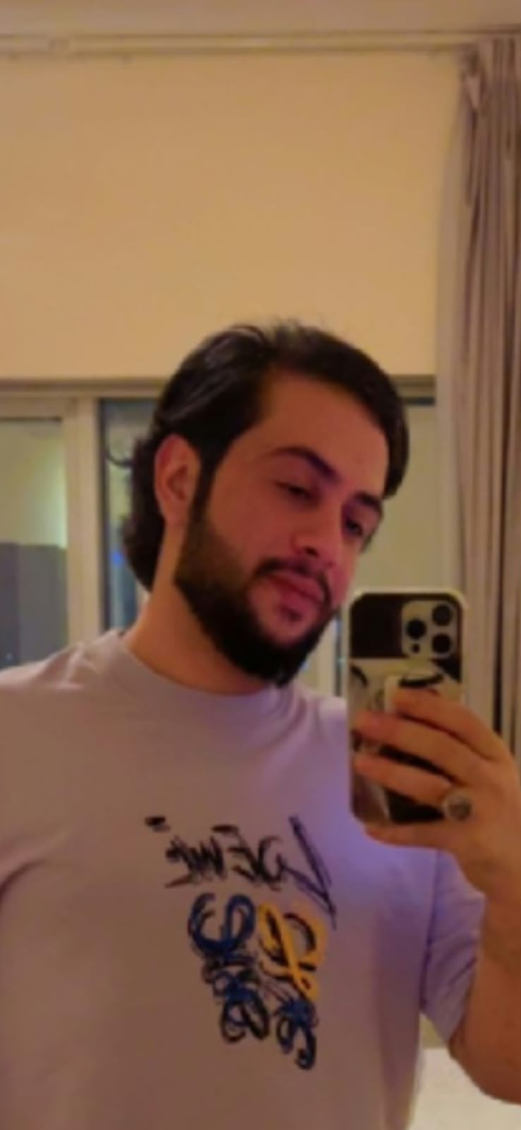 Maher in a casual mirror photo